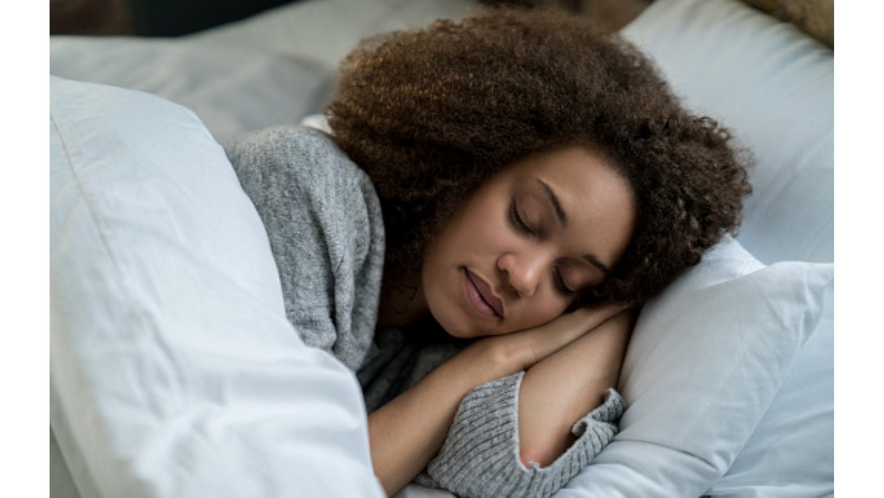 A woman asleep in bed A woman asleep in bed